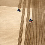 An aerial view of fields being plowed